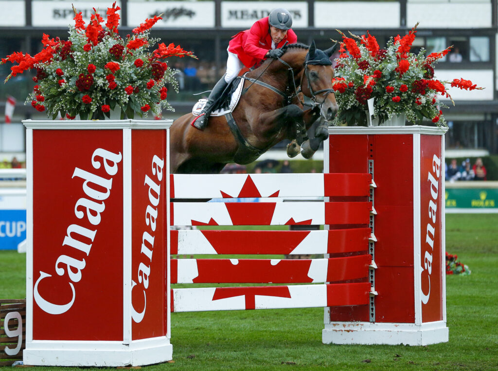 Dreher of Germany jumps on his horse Colore to win the Nations' Cup event in a jump off during the Spruce Meadows Masters in Calgary.